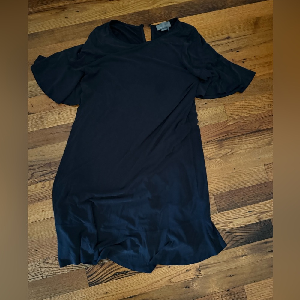 Anthropologie navy blue swing dress with ruffle sleeves and bottom